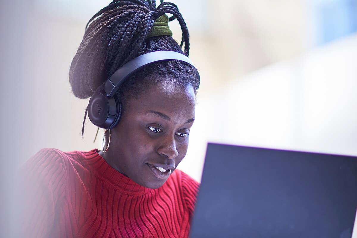 Female wearing a headset in a contact centre