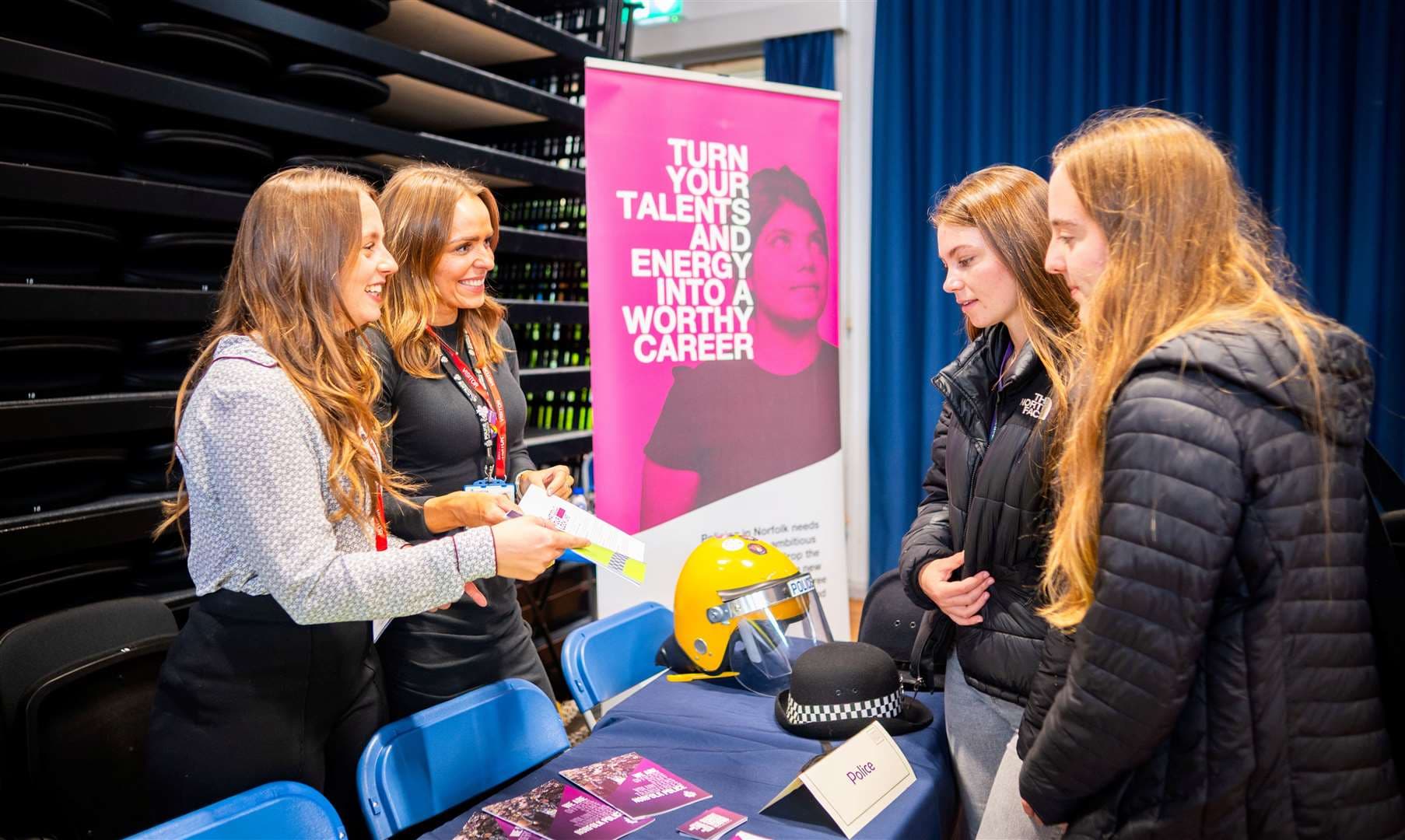 Representatives with students at one of the stands. Picture: Ian Burt