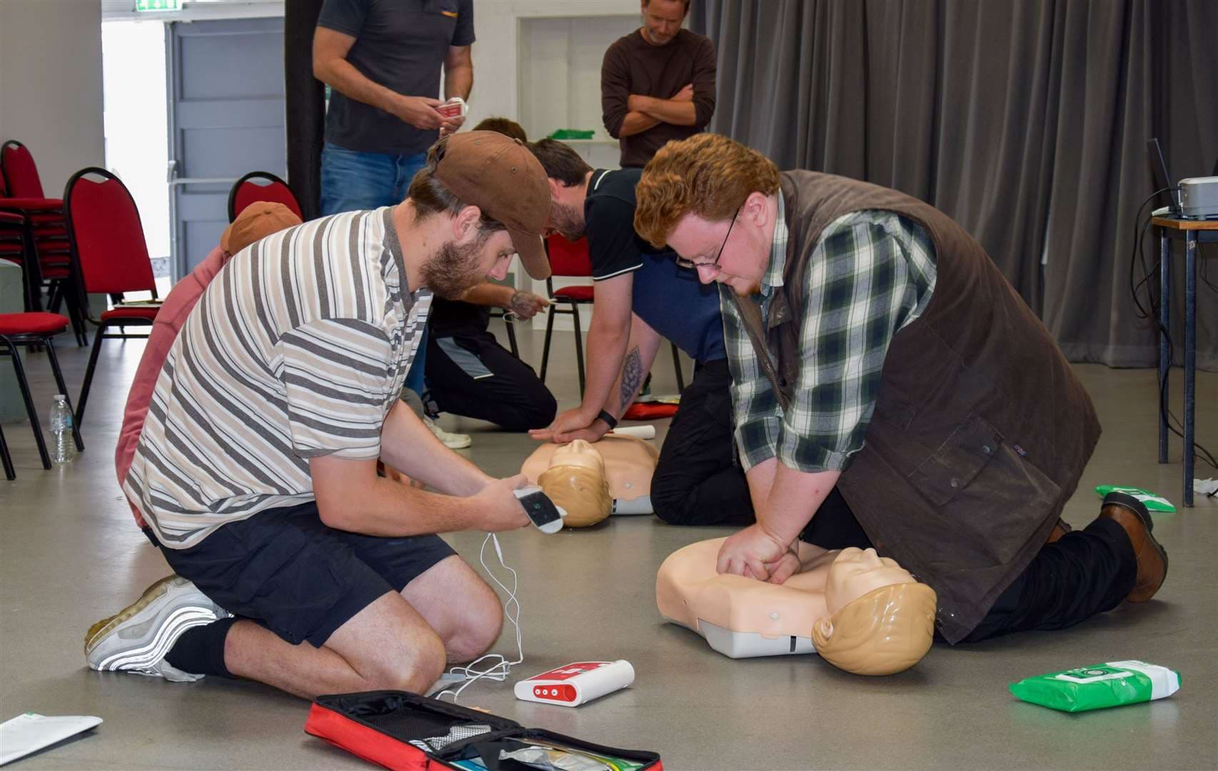 Participants practise life saving skills.