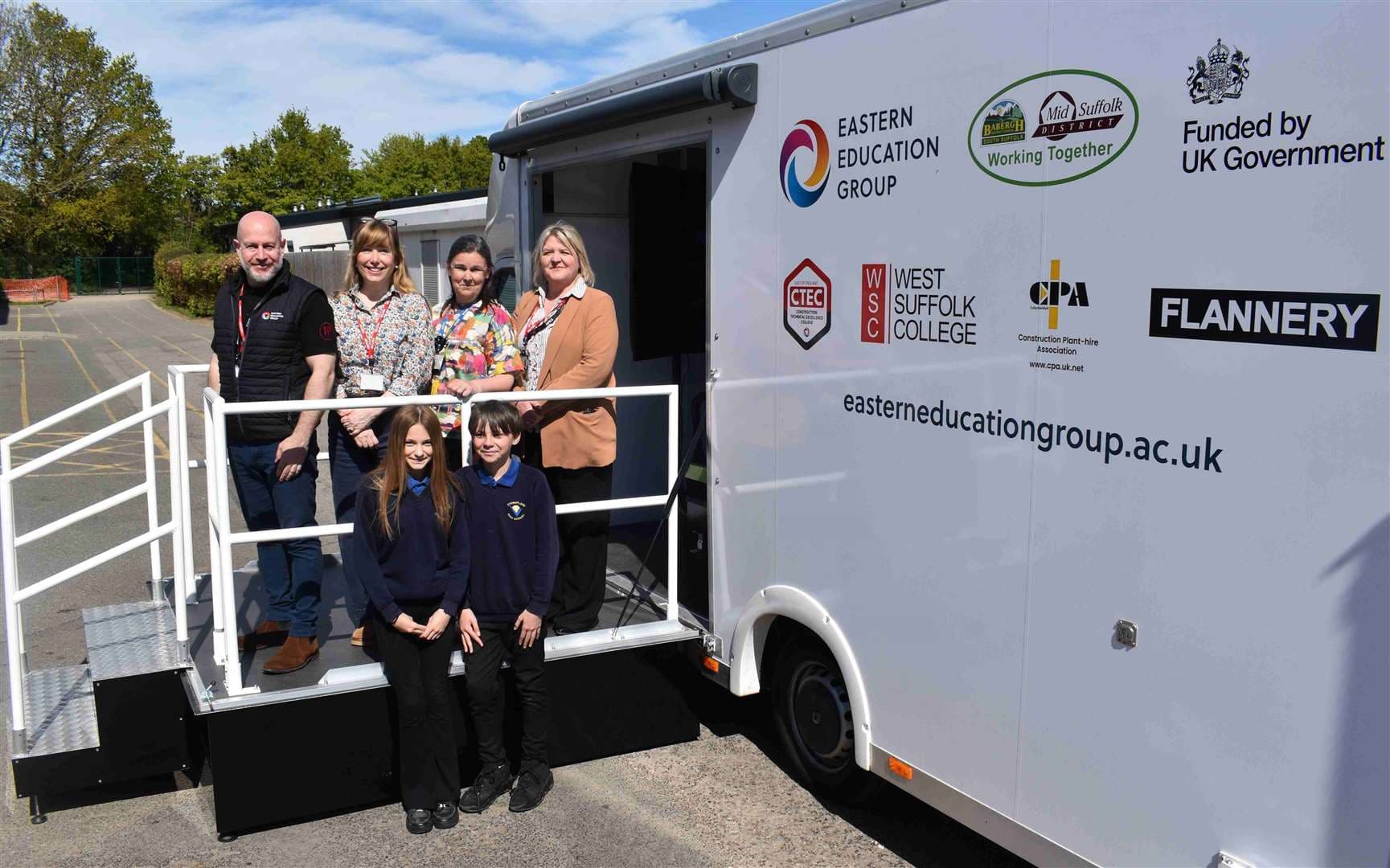 Representatives from Eastern Education Group, Babergh and Mid Suffolk District Councils and Stowupland High School by the sim van. Picture: Eastern Education Group